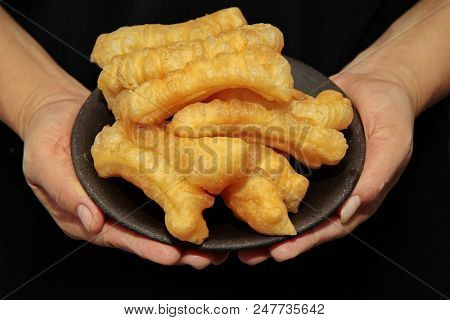 Ready Served Deep-fried Dough Stick Call Patongko. Selective Focus.