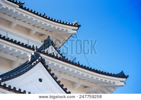 Odawara Castle Is A Hirayama-style Japanese Castle, Odawara, Japan. Isolated On Blue Background.