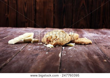 Stack Of Macadamia Nut And White Chocolate Cookies On Table With Chocolate Chip