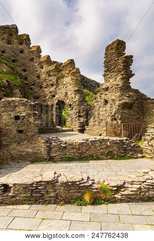 Tintagel, United Kingdom - May 02, 2014: View Of Tintagel Island And Legendary Tintagel Castle Ruins