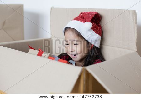 Asian Girl Holding Gift Box. Kid Holding Box With Smiling.