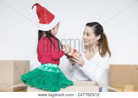 Attractive Asian Girl Received A Present From Her Mom. Kid Received Gift With Attractive Smiling. Ki