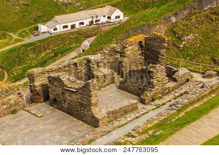 Tintagel, United Kingdom - May 02, 2014: View Of Tintagel Island And Legendary Tintagel Castle Ruins