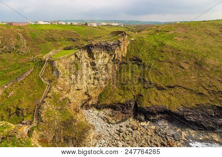 Tintagel, United Kingdom - May 02, 2014: View Of Tintagel Island And Legendary Tintagel Castle Ruins