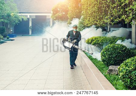Man Work Fogging To Eliminate Mosquito For Preventing Spread Dengue Fever And Zika Virus