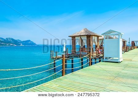 Wooden Beach Pavilions On The Shore Of A Sandy Beach - The Mediterranean Coast, Beldibi, Antalya, Tu