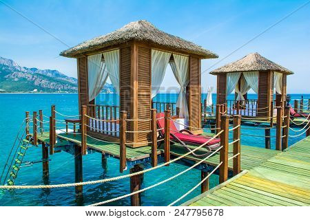 Wooden Beach Pavilions On The Shore Of A Sandy Beach - The Mediterranean Coast, Beldibi, Antalya, Tu