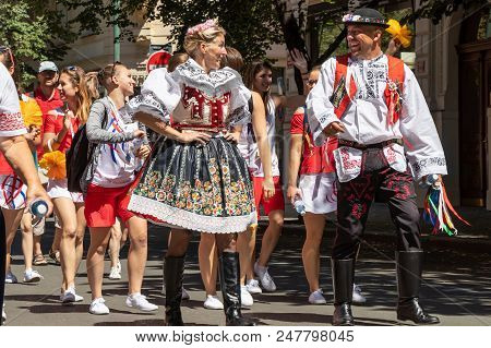 Prague, Czech Republic - July 1, 2018: People In Folk Costumes Parading At Sokolsky Slet, A Once-eve