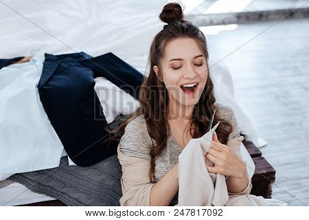 Hysterical Woman. Hysterical Emotional Woman Feeling Extremely Furious While Holding Scissors In Her