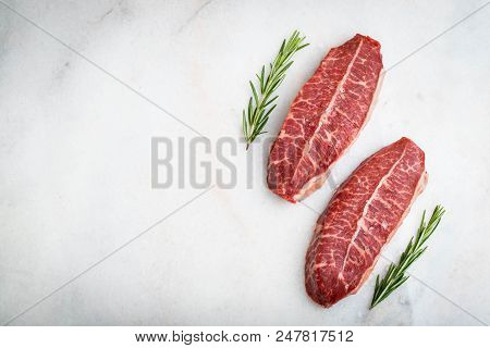 Raw Fresh Meat Top Blade Steaks On Light Background. Top View With Copy Space.