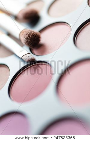 Macro close up photogaph of make up or makeup pallet and brushes