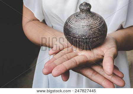 Old Thai Antique Clay Pot Earth Ware On Palm Of Woman
