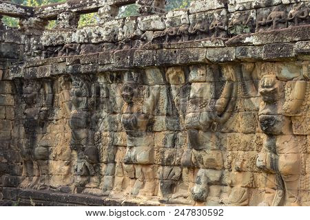 Ancient Temple Stone Carved Bas-relief In Angkor Wat. Human-like Animals Bas-relief Closeup. Angkor 