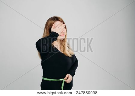 Young Blonde Haired Woman Wearing In Black Sweater Check Her Stomach Fat With Green Line Tape, Gestu