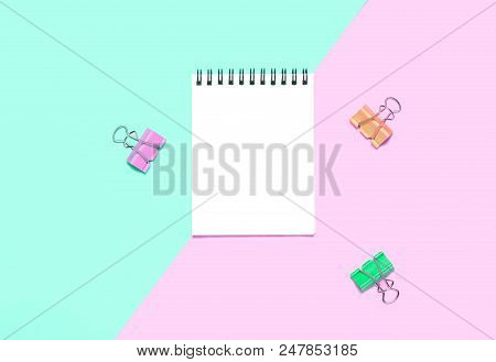 Empty Notebook Or Notepad On Pink And Blue Background. Creative Minimalism Chancery Concept. Top Vie