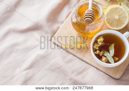 Tea With Linden, Honey And Lemon. The Tray On The Bed, The Concept Of The Treatment Of Colds