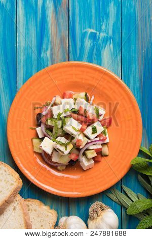 Greek salad with feta cheese cubes and fresk vegetables