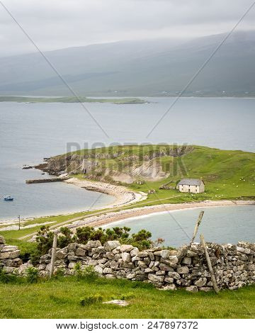 A Rural View Over Loch Eriboll In The Northern Highlands Of Scotland With A Farmhouse On The Foregro