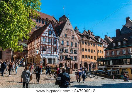 Nuremberg, Germany - April 14, 2018: Tourists On The Tiergarten Square In Nurnberg Near Albrecht Dur