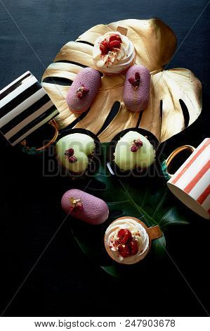 Moscovie Cakes Purple And Lemon Yellow. Pistachio And Fruit. Meringue Anna Pavlova . Culinary Art. G
