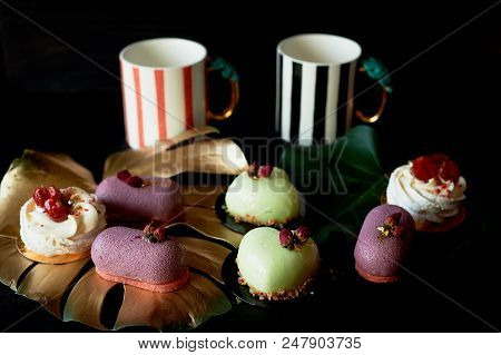 Moscovie Cakes Purple And Lemon Yellow. Pistachio And Fruit. Meringue Anna Pavlova . Culinary Art. G