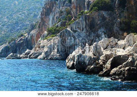 Landscape With Rocky Shore And Blue Sea