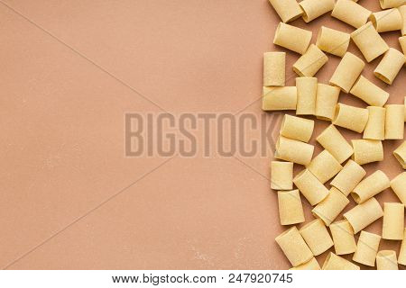 Border Made Of Mezzi Pasta On Pink Background, Top View