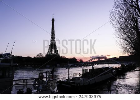 The Eiffel Tower In Paris, France At The Evening
