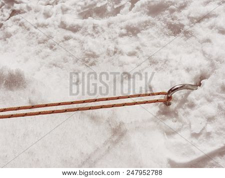 Chrome Steel Hook Anchor Camping Tent In Snow. Process Of Installing Tent Setting Up Tent Outdoors.