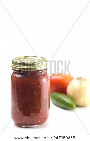 Homemade Salsa In A Home Canning Jar On A White Background