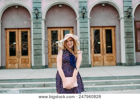 Girl Shy On City Street Hat Handbag