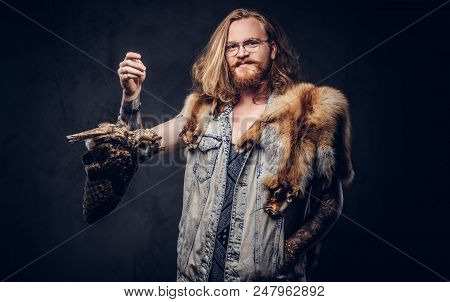 Portrait Of A Smiling Tattoed Redhead Hipster Male With Long Luxuriant Hair And Full Beard Dressed I