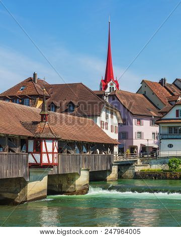 Medieval Covered Bridge Over The Reuss River, Buildings Of The Historic Part Of The Town Of Bremgart