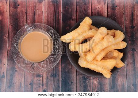 Ready Served Of A Cup Of Coffee And Patongko (deep-fried Dough Stick)