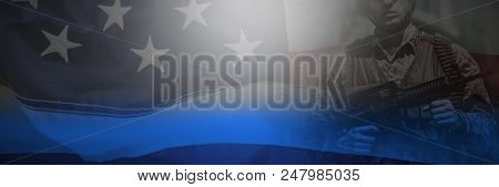 Full frame of wrinkled American flag against portrait of military soldier standing with rile