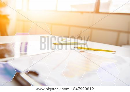 Tablet On The Table With Paper Chart