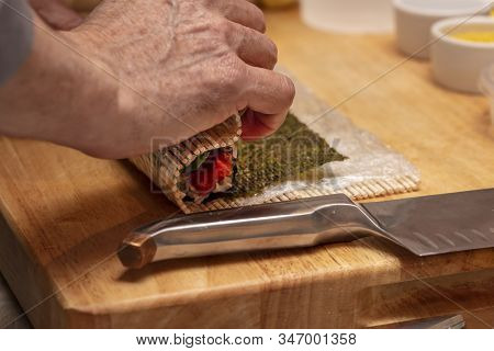 Sushi Roll Being Made In A Demonstaration Class