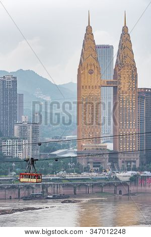 Chongqing, China - June 12, 2018 : Urban Cable Car Transporting Tourists Abobe The Yangze River With