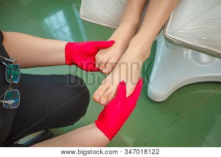 Podiatrist Treating Toenail Fungus. Podology Treatment. Close-up.