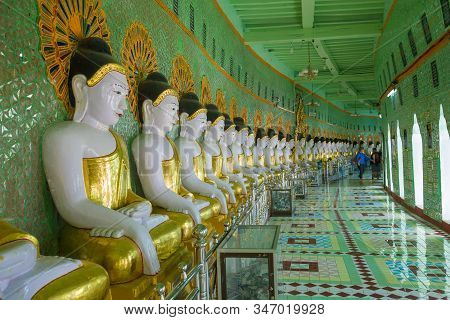 Sagaing, Myanmar - December 20, 2016: Sculptures Of A Seated Buddha In The Gallery Of The Cave Pagod