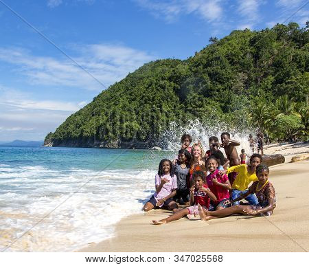 Papua New Guinea, Jayapura, August, 15, 2019 - Indonesian Funny Children Are Photographed With A Whi