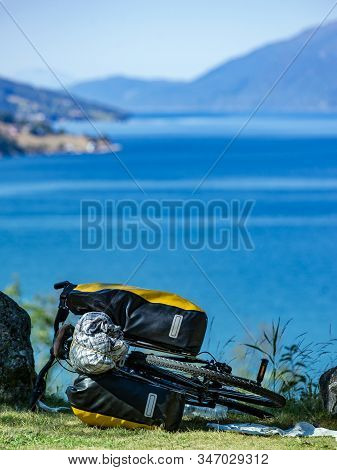 Mountain Bicycle With Attached Bag Saddlebag Against Nature, Mountains Fjord Landscape In Norway