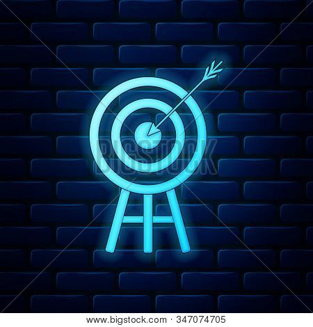 Glowing Neon Target With Arrow Icon Isolated On Brick Wall Background. Dart Board Sign. Archery Boar