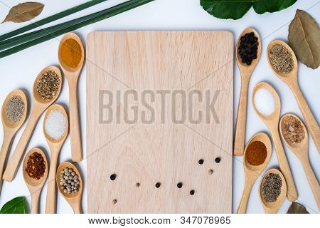 Various Spices In Wooden Spoon On Wood Table Background, Sugar, Pepper, Salt, Turmeric, Rosemary, Or