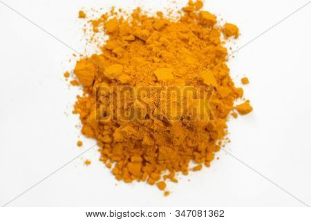 Yellow Turmeric Root Powder On A White Background. Spice For Cooking Top View. Turmeric Seasoning In
