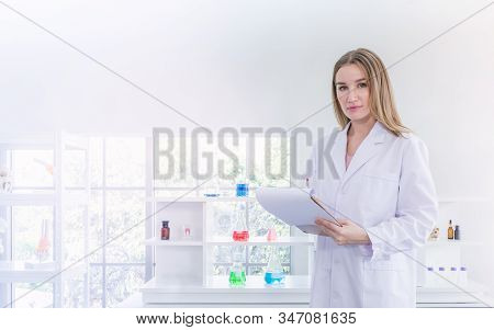 Pretty Scientist Work Reserching And Recording In Chemical Laboratory, Science And Healthy Or Medica