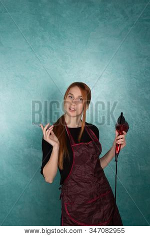 Smiling Girl Hairdresser Holds Fan And Scissors In Hands