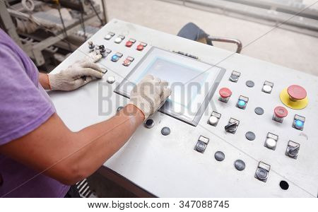 Hands Of A Worker On A Control Panel Of A Brick Conveyor. Close-up