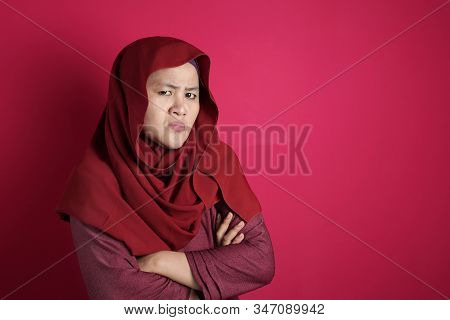 Portrait Of Angry Cynical Asian Muslim Woman With Suspicious Expression Looking At Camera, Mistrust 