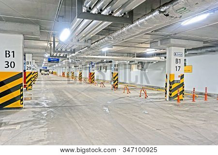 Parking Garage - Interior Shot Of Multi-story Car Park, Underground Parking With Cars.